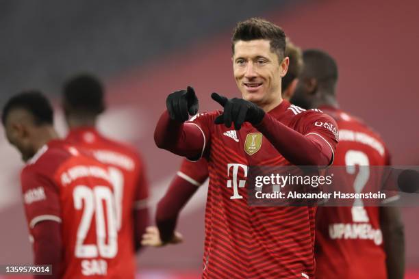 Robert Lewandowski of Muenchen scores his team's fourth goal during the Bundesliga match between FC Bayern München and VfL Wolfsburg at Allianz Arena...