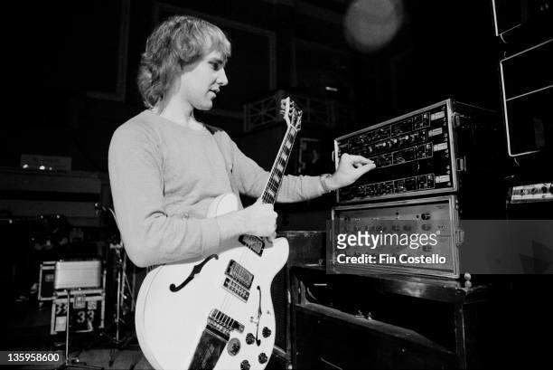 21st JUNE: Guitarist Alex Lifeson of Canadian progressive rock band Rush adjusts levels during a soundcheck at the De Montfort Hall, Leicester on...