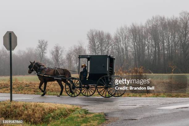 An Amish family is seen traveling on December 17, 2021 in Wingo, Kentucky. Multiple tornadoes struck several Midwest states late evening on December...