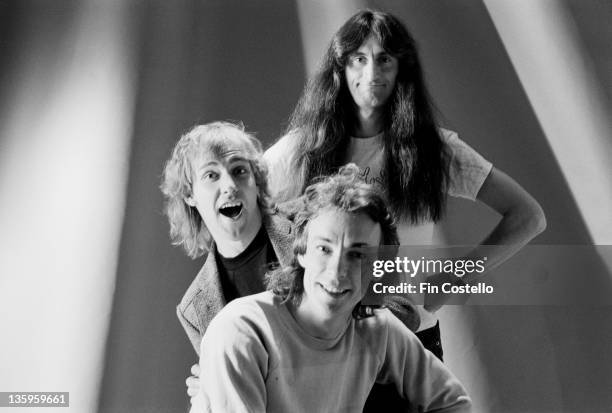 Guitarist Alex Lifeson, Bassist Geddy Lee and drummer Neil Peart from Canadian Progressive rock group Rush posed in London during the Permanent Waves...