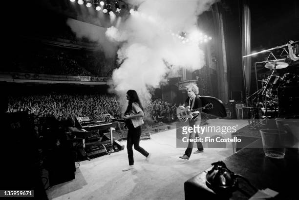 Canadian Progressive rock group Rush perform live on stage in front of an audience at London's Hammersmith Odeon during their Permanent Waves tour of...