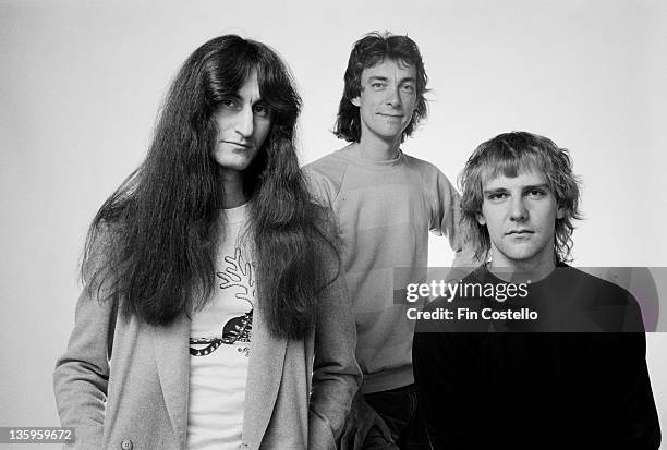 Bassist Geddy Lee, drummer Neil Peart and guitarist Alex Lifeson from Canadian Progressive rock group Rush posed in London during the Permanent Waves...