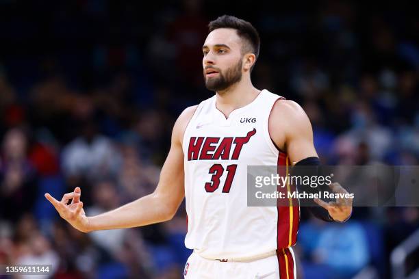 Max Strus of the Miami Heat celebrates a three pointer against the Orlando Magic during the second half at Amway Center on December 17, 2021 in...