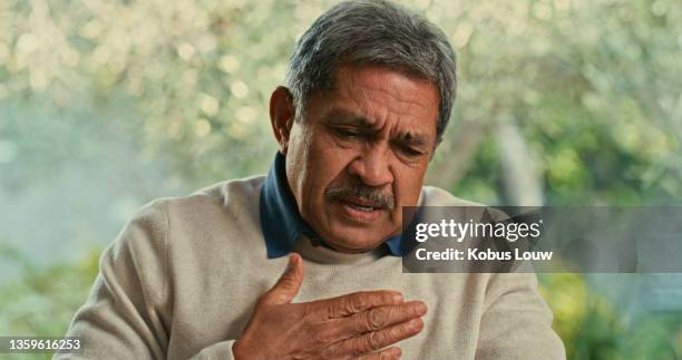 shot of a senior man suffering from chest pain at home - man with chest pain stock pictures, royalty-free photos & images