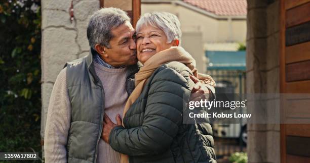 shot of a happy senior couple embracing in their backyard at home - new husband stock pictures, royalty-free photos & images