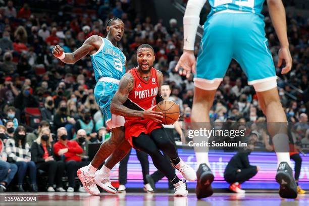 Damian Lillard of the Portland Trail Blazers drives to the basket past Terry Rozier of the Charlotte Hornets during the first half at Moda Center on...