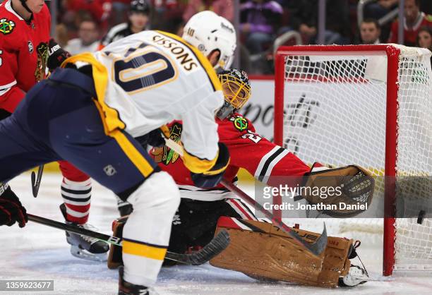 Marc-Andre Fleury of the Chicago Blackhawks reaches for a puck shot by Colton Sissons of the Nashville Predators at the United Center on December 17,...