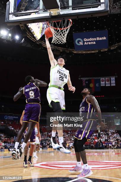 Zhou Qi of the Phoenix slam dunks during the round three NBL match between Sydney Kings and South East Melbourne Phoenix at Qudos Bank Arena on...