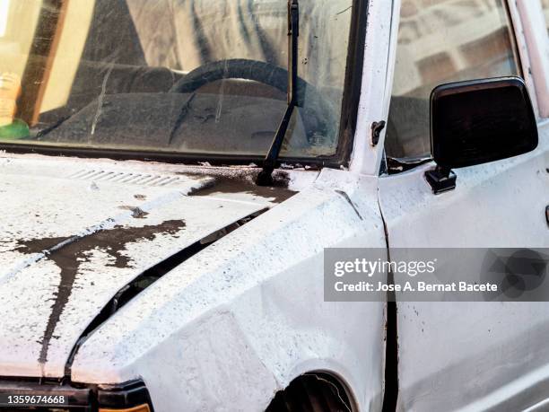 volcanic eruption with rain of volcanic ash particles on the body of a car. - car wash building stock pictures, royalty-free photos & images
