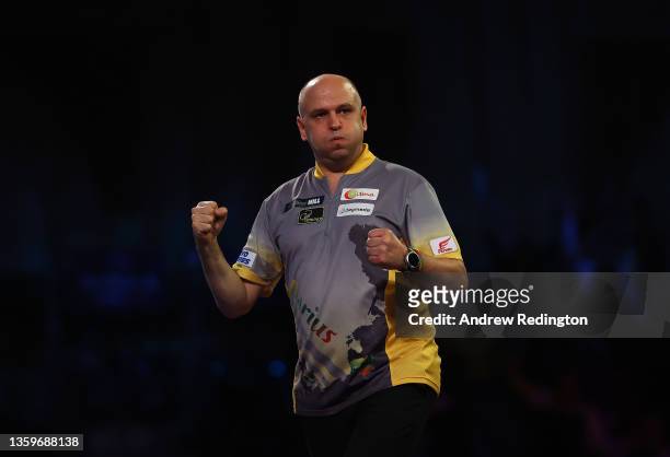 Darius Labanauskas of Lithuania celebrates a nine-darter during Day Four of the PDC William Hill World Darts Championship at Alexandra Palace on...