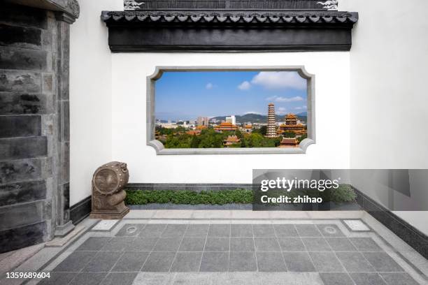 chinese traditional building courtyard with viewing windows - chinese window pattern stockfoto's en -beelden