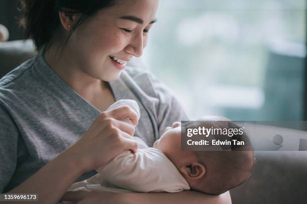 asian chinese mother bonding time with her baby boy toddler at home - asian mum stockfoto's en -beelden