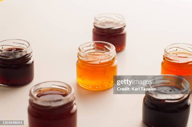 financial concepts background variety of preserved fruit jams - marmalade stock pictures, royalty-free photos & images
