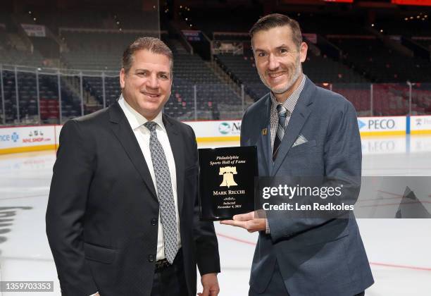 Former Philadelphia Flyer Mark Recchi recently inducted into the Philadelphia Sports Hall of fame was presented with his Hall of Fame plaque by Mike...