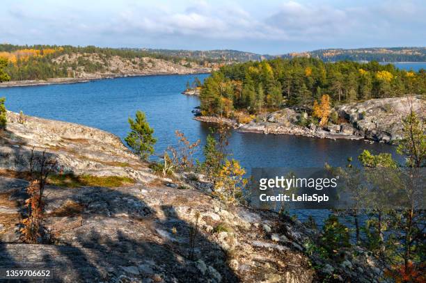 view of the colorful islands from the high shore of the lake in an autumn evening - lake ladoga stock pictures, royalty-free photos & images