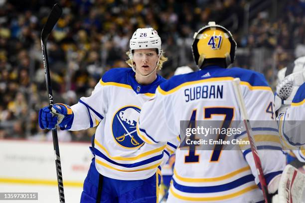 Rasmus Dahlin of the Buffalo Sabres celebrates his goal with Malcolm Subban during the third period of a game against the Pittsburgh Penguins at PPG...