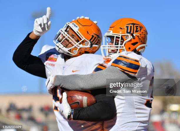 Tight end Trent Thompson and fullback Forest McKee of the UTEP Miners celebrate after Thompson caught a pass for a touchdown against the Fresno State...