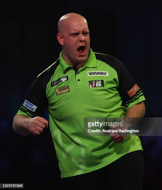 Michael van Gerwen of The Netherlands celebrates during Day Four of the 2021/22 PDC William Hill World Darts Championship at Alexandra Palace on...