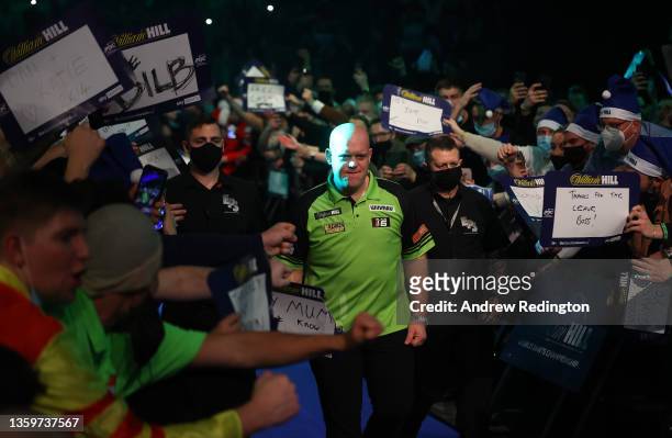 Michael van Gerwen of The Netherlands walks on for his match during Day Four of the 2021/22 PDC William Hill World Darts Championship at Alexandra...