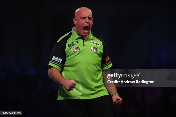 Michael van Gerwen of The Netherlands celebrates during Day Four of the 2021/22 PDC William Hill World Darts Championship at Alexandra Palace on...