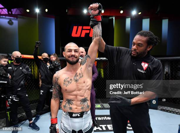 Cub Swanson celebrates after his knockout victory over Darren Elkins in their featherweight fight during the UFC Fight Night event at UFC APEX on...
