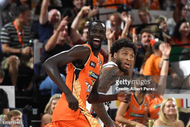 Majok Deng of the Taipans smiles after scoring a three during the round three NBL match between the Cairns Taipans and Adelaide 36ers at Cairns...