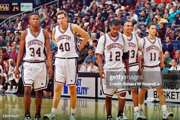 University of Connecticut's Ray Allen , Travis Knight , Kevin Ollie , Donnie Marshall , and Doron Sheffer walk on the court during a game in Storrs...