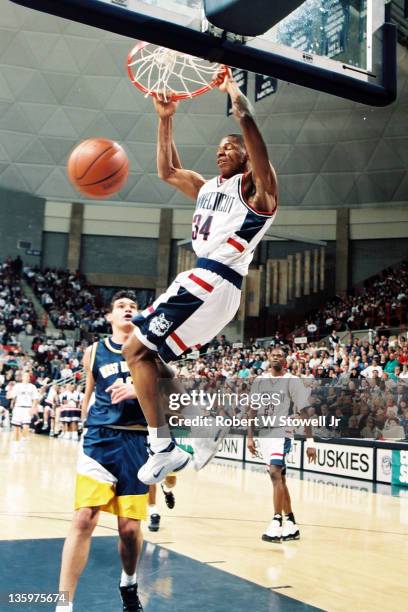 University of Connecticut star player Ray Allen dunks home two points in a game against West Virginia, Storrs CT 1996.