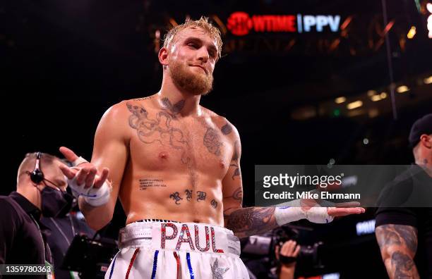 Jake Paul reacts to knocking out Tyron Woddley in the sixth round during an eight-round cruiserweight bout at the Amalie Arena on December 18, 2021...
