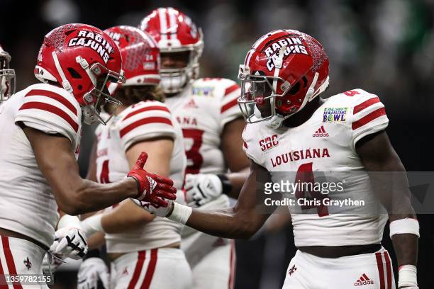 Emani Bailey of the Louisiana-Lafayette Ragin Cajuns reacts after a touchdown against the Marshall Thundering Herd during the R+L Carriers New...