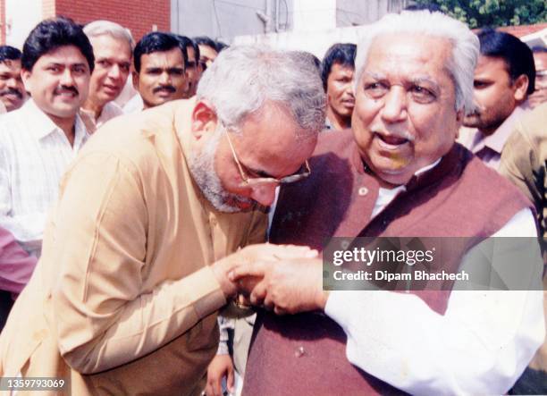 Narendra Modi taking blessings from Mr Keshubhai Patel on being appointed as Chief Minister of Gujarat on 7th october 2001.
