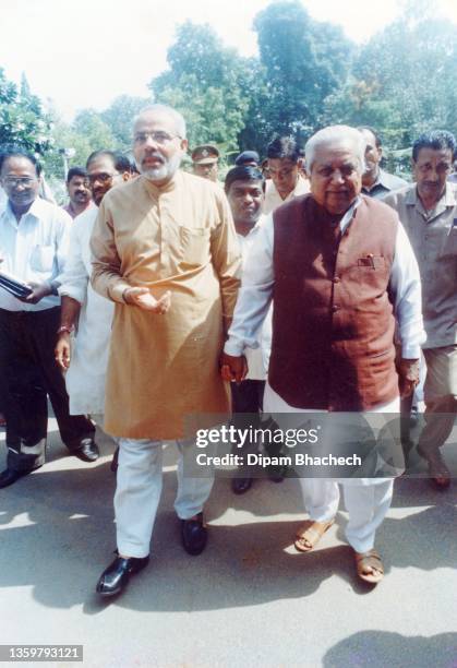 Narendra Modi, Chief Minister of Gujarat), arrives Gujarat to take oath as Chief Minister of Gujarat on 7th October 2001. On right to Mr Modi is Mr...