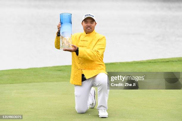 Zhang Jin of China holds the trophy celebrates after winning the 27th Volvo China Open at Genzon Golf Club on December 19, 2021 in Shenzhen, China.