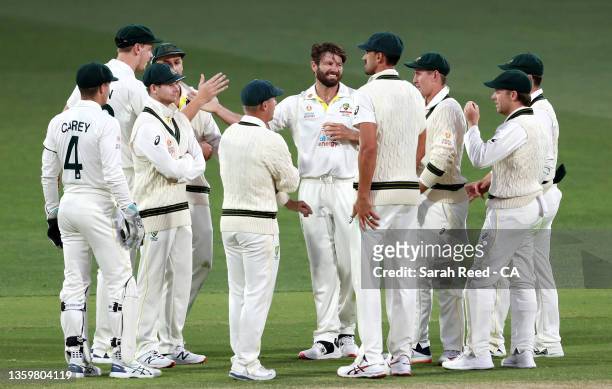 Michael Neser of Australia surrounded by team mates after claiming the wicket of Dawid Malan of England LBW for 20 runs during day four of the Second...