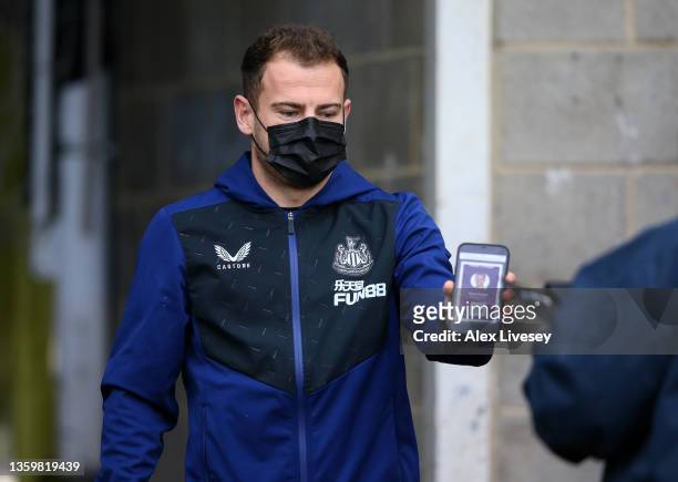 Ryan Fraser of Newcastle United has his Covid-19 pass scanned as he arrives at the stadium prior to the Premier League match between Newcastle United...
