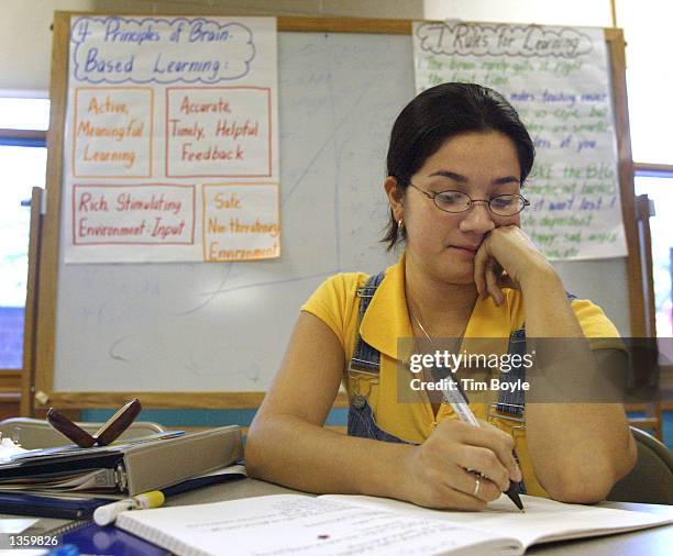 Teacher Claudia Torres, of the Josefa Ortiz De Dominguez Elementary School, takes notes as she and other teachers headed back to school for the...