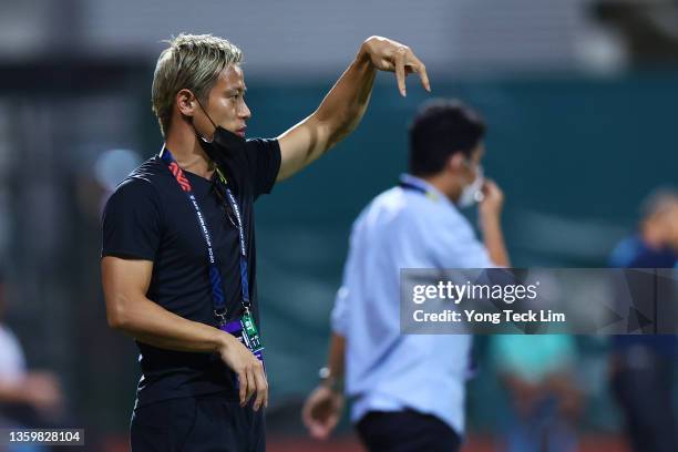 General manager and head coach Keisuke Honda of Cambodia calls for a play during the first half of the AFF Suzuki Cup Group B game against Vietnam at...