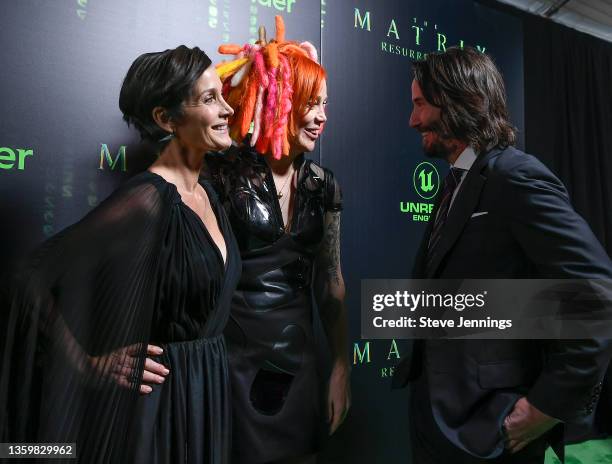 Actress Carrie-Anne Moss, Director Producer and Writer Lana Wachowski and Actor Keanu Reeves attends "The Matrix Resurrections" Red Carpet U.S....