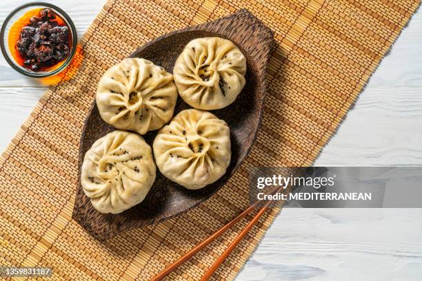 steamed panpao vegan dumplings recipe with chili oil asian food - korean food stock pictures, royalty-free photos & images