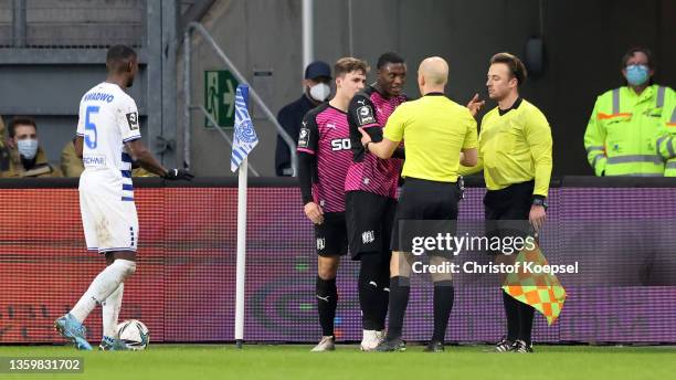 Aaron Opoku of Osnabrueck speaks to referee Nicolas Winter after being treated rassistic by comments of fans of Duisburg during the 3. Liga match...