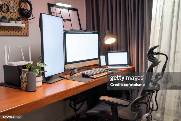 home office for work of place, computer device with white screen on desk in apartments, working at home concept - ergonomie stockfoto's en -beelden