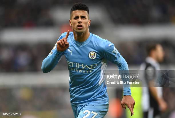 Joao Cancelo of Manchester City celebrates after scoring their sides second goal during the Premier League match between Newcastle United and...
