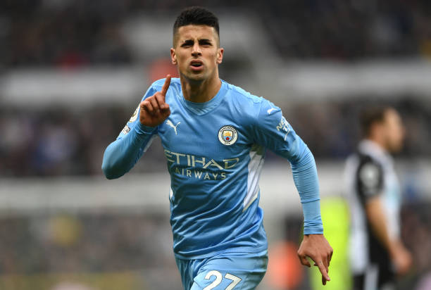 Joao Cancelo of Manchester City celebrates after scoring their sides second goal during the Premier League match between Newcastle United and...