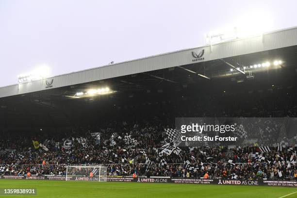 General view inside the stadium after the Sports Direct signage has been removed, as Newcastle United fans wave flags during the Premier League match...