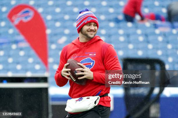 Josh Allen of the Buffalo Bills warms up before the game against the Carolina Panthers at Highmark Stadium on December 19, 2021 in Orchard Park, New...