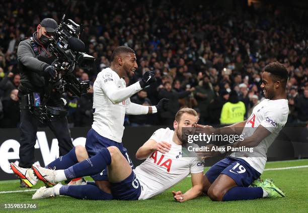 Harry Kane celebrates with teammates Emerson Royal and Ryan Sessegnon of Tottenham Hotspur after scoring their team's first goal during the Premier...