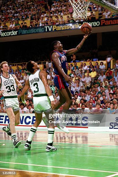 Joe Dumars of the Detroit Pistons drives to the basket against the Boston Celtics in 1986 during the NBA game at the Boston Garden in Boston,...