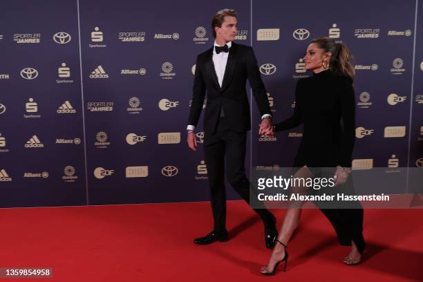 Alexander Zverev arrives with Sophia Thomalla for the "Sportler des Jahres" Award 2021 Gala at Kurhaus Baden-Baden on December 19, 2021 in...