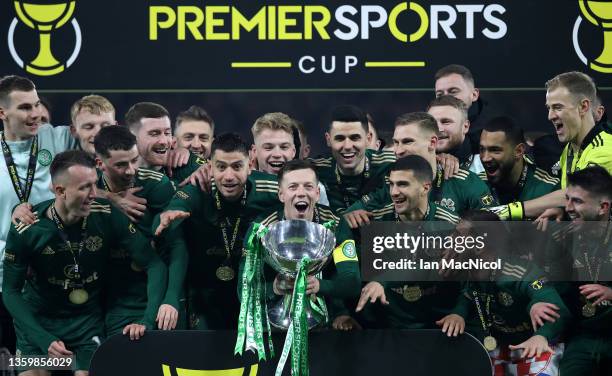 Callum McGregor of Celtic lifts the Premier Sports Cup trophy after victory in the Premier Sports Cup Final between Celtic and Hibernian at Hampden...