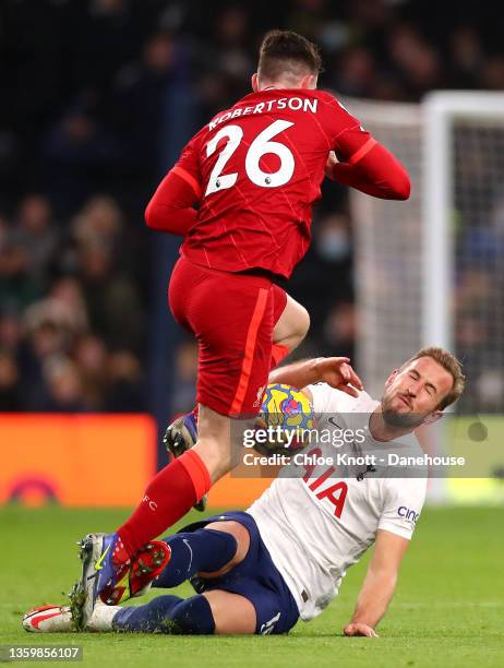 Harry Kane of Tottenham Hotspur and Andy Robertson of Liverpool collide during the Premier League match between Tottenham Hotspur and Liverpool at...